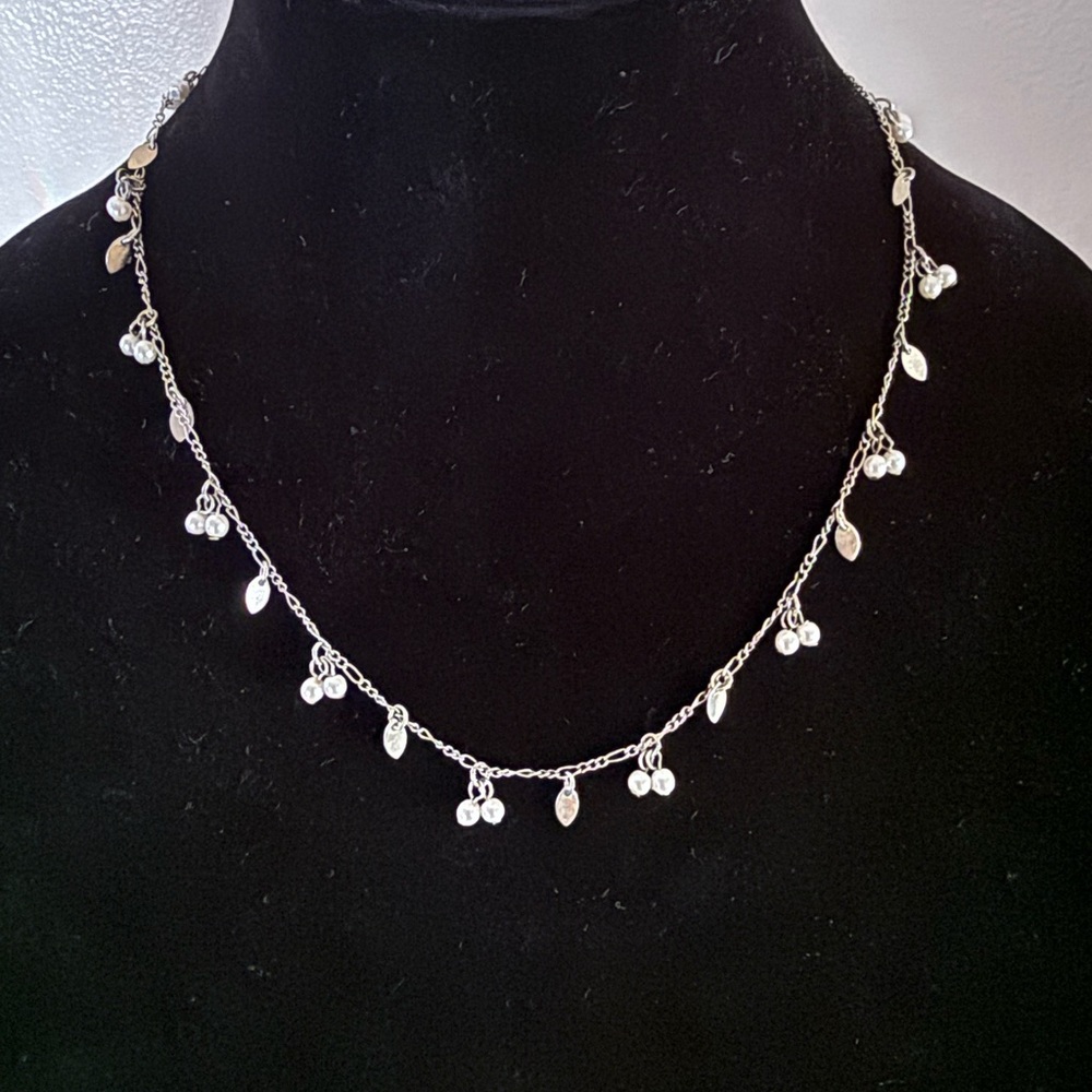 Elegant Silver Necklace with Leaf and Bead Details